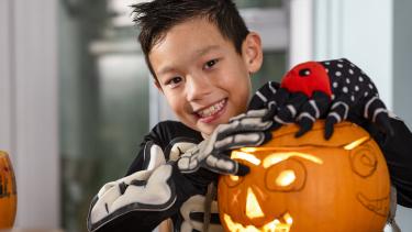 School aged boy celebrating Halloween 
