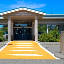 Mathxwí Elementary Exterior Image with orange crosswalk in front